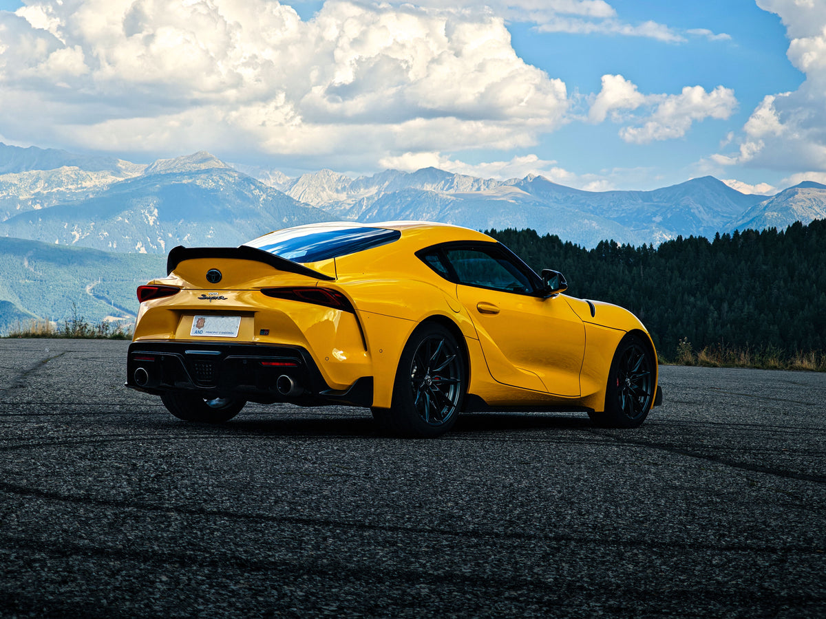 Yellow Toyota GR Supra from performand in Andorra mountains